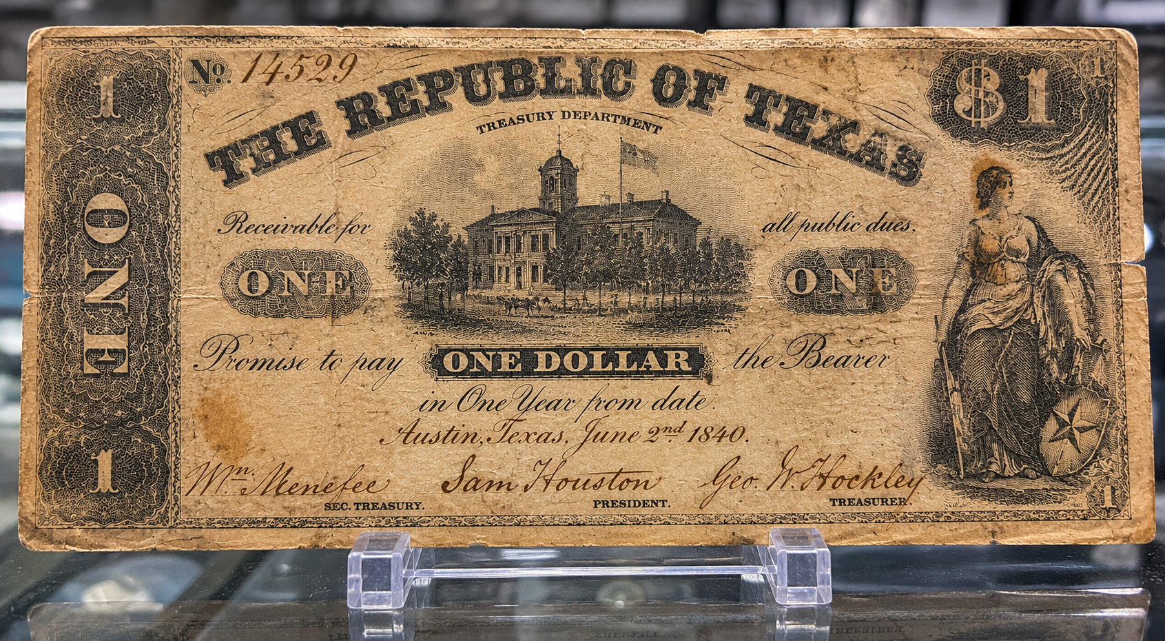 A close-up of a historical Republic of Texas paper banknote.