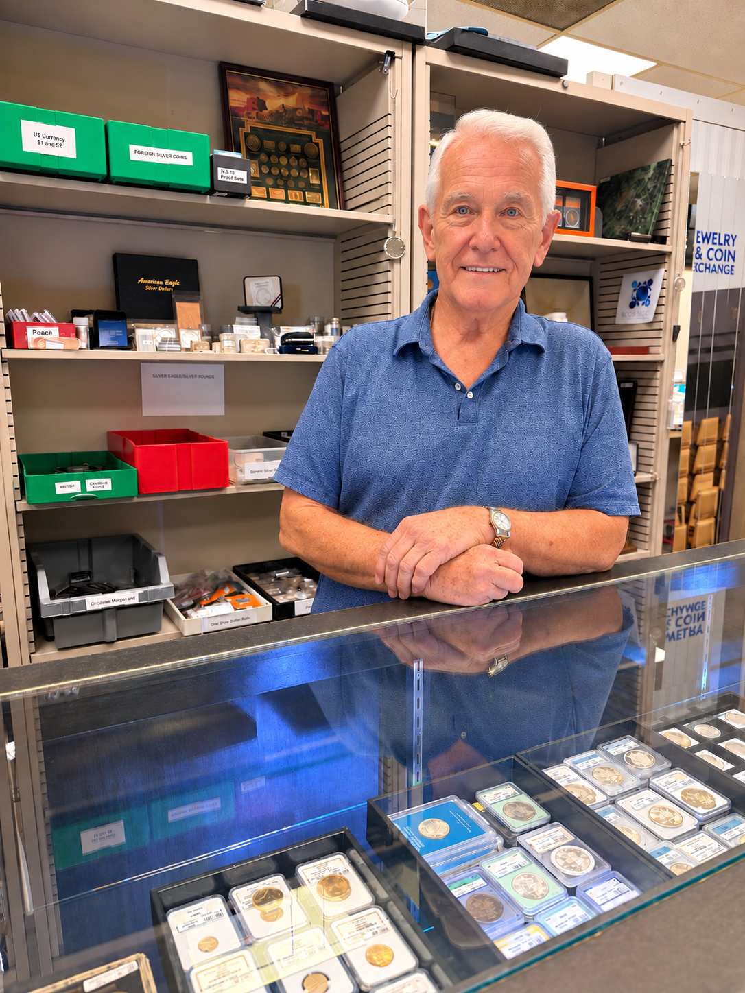 A team member behind the collectible coin counter at David’s Jewelry & Coin Exchange in College Station.