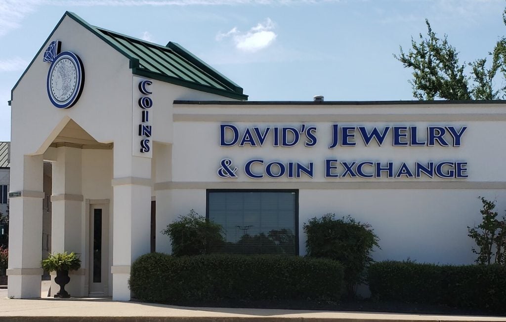 The David’s Jewelry & Coin Exchange sign beneath a green storefront roof.