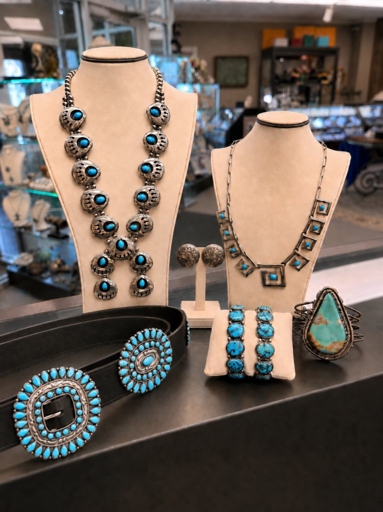 Turquoise necklaces and Southwestern jewelry displayed on necklace busts.